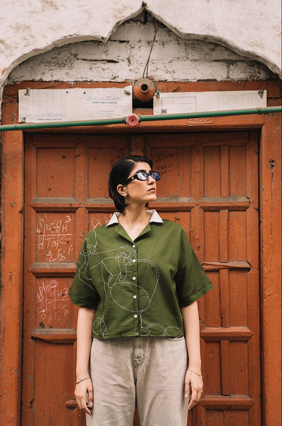 Hand Embroidered Portrait of a Figure Pouring Tea
