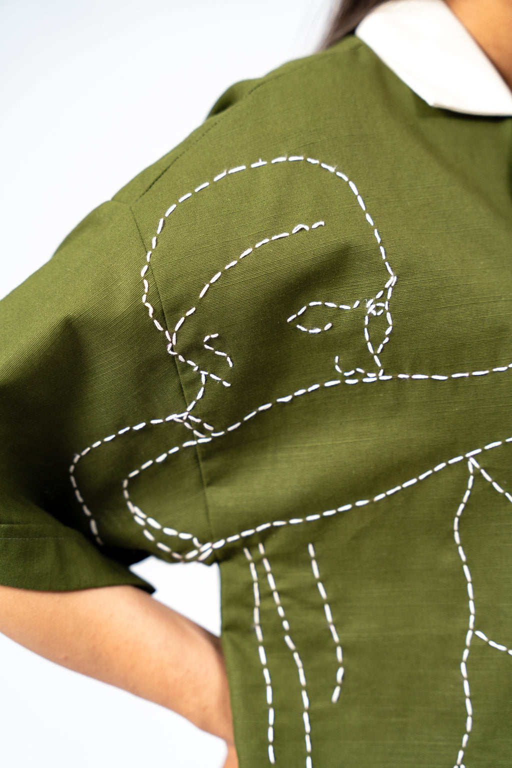 Hand Embroidered Portrait of a Figure Pouring Tea